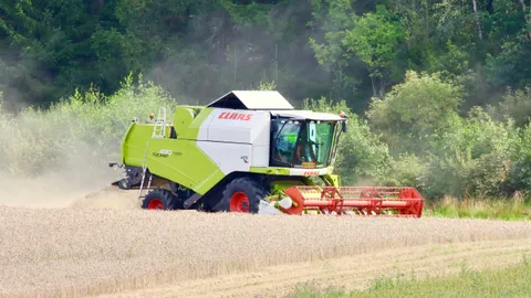 Bawcro technician installing bird deterrents on a Yorkshire farm to protect crops from pigeon damage.