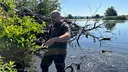 Bawcro clearing fallen tree branches and debris from the lake at Denton Reserve as part of ongoing land management works near Ilkley.